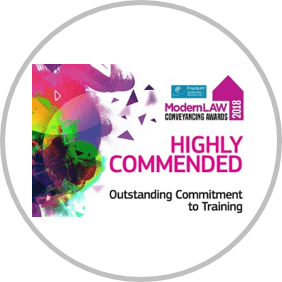 An award sticker showing PM Property Lawyers achieving the "highly commended for outstanding commitment to training" title for the Modern Law Conveyancing Awards 2018.