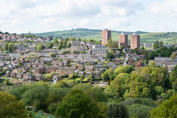 An aerial view of a large residential area in Sheffield on a cloudy day.